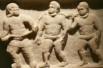 Marble relief of Roman collared slaves