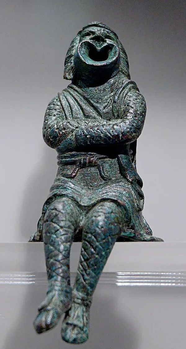 Bronze statue of an actor playing a slave and wearing a comic mask