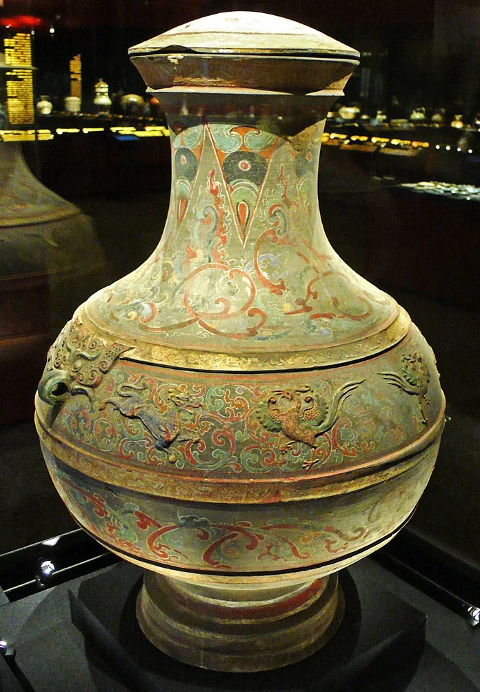 Painted porcelain jar with Western-Han designs with raised reliefs of dragons, phoenixes, and taoties